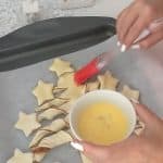 covering the biscoff puff pastry tree with egg wash