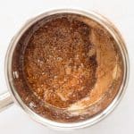 Butter and brown sugar melting together in a saucepan to make toffee