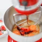Mixing wet ingredients for strawberry cupcake batter in stand mixer