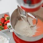 adding dry ingredients then milk for strawberry shortcake cupcakes