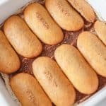 Step 2: assembling tiramisu, spread ladyfingers in layer