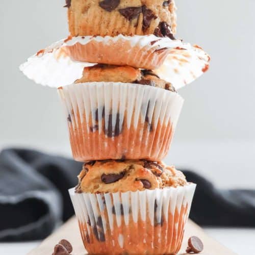 3 high protein chocolate chip muffins stacked on top of each other