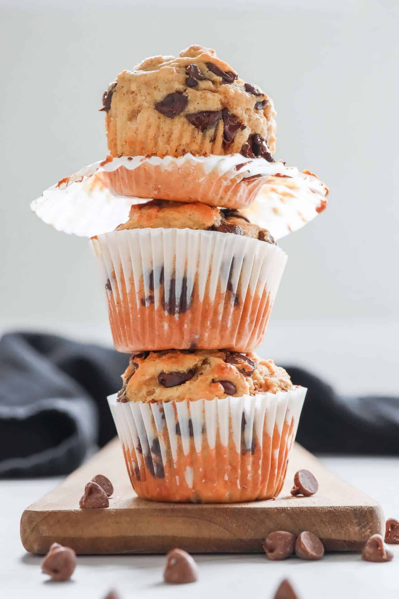 3 high protein chocolate chip muffins stacked on top of each other