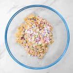 fold in sprinkles for birthday cake stuffed oreo cookies