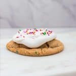 pipe buttercream on top of birthday cake cookie and top with sprinkles