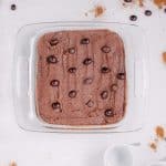 espresso martini brownies topped with chocolate frosting and espresso beans