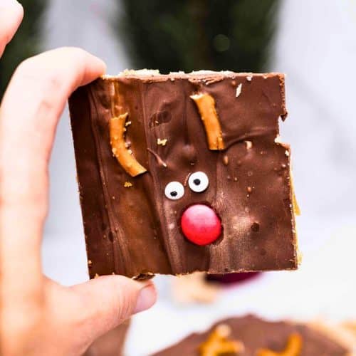 reindeer Christmas toffee piece being held up by hand