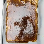 toffee mixture poured on saltine crackers