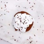 hot chocolate cookie topped with marshmallow fluff and chocolate shavings