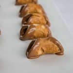 place chocolate dipped cannoli shells on parchment paper to set