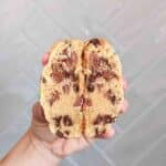 Mini Egg cookie being held up by hand