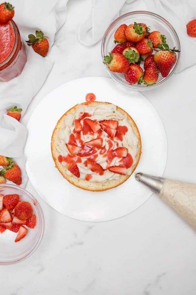 Strawberry Shortcake layer 1 with chantilly cream, strawberries & strawberry sauce