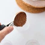 scoop quinoa layer into heart mold for date bark hearts