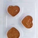 final layer of chocolate added to date bark hearts