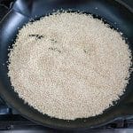 toasting quinoa in skillet for date bark