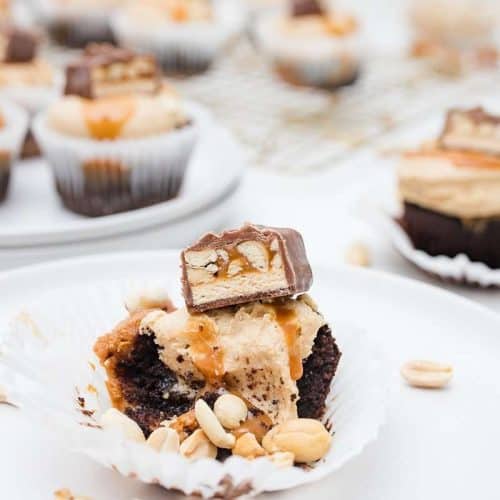 Snickers Cupcake half eaten with remaining in background
