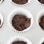 batter added to cupcake liner for snickers cupcakes