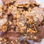 Snickers date bark with crunchy quinoa broken into pieces