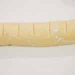 Roll up tightly from the long edge. Then, using a knife or unflavored dental floss to mark the dough, evenly divide it into 12 equal pieces and cut to make the cinnabunnies