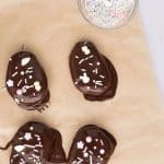 cashew butter reese egg easter treats placed on parchment paper to set
