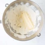 butter being added to cream cheese for frosting