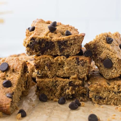 high protein chickpea blondies cut into squares and stacked on top of each other