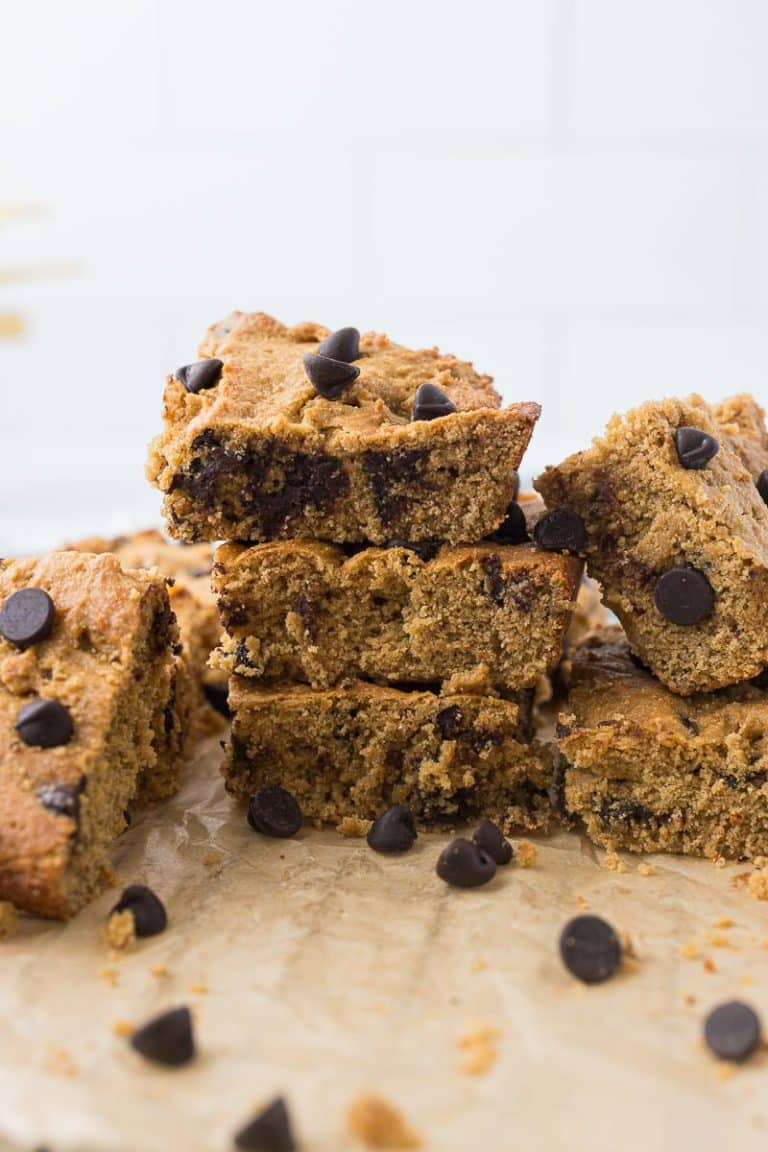 high protein chickpea blondies cut into squares and stacked on top of each other