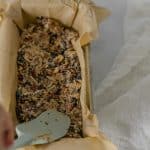 Press into a parchment-lined loaf pan using a spatula or another piece of parchment