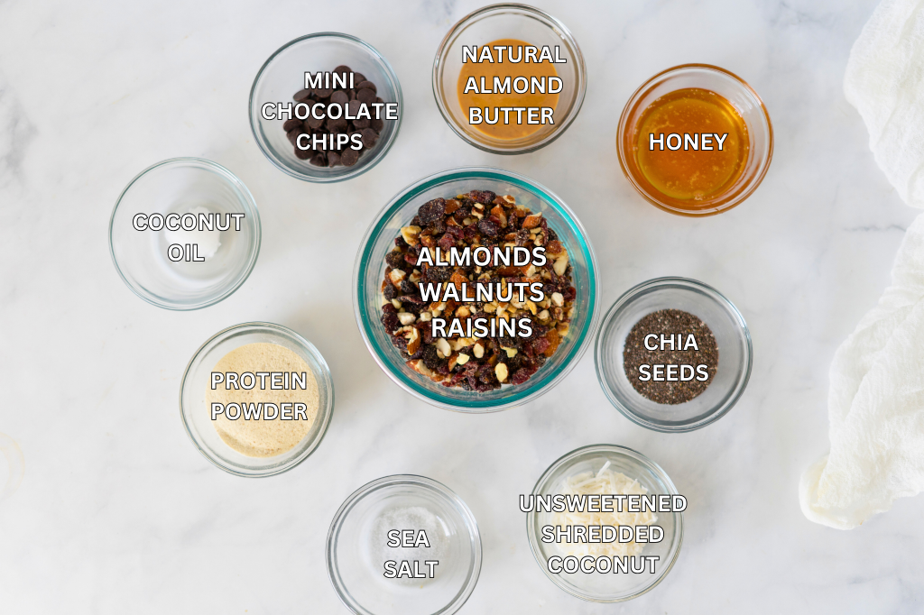ingredients in clear glass bowls for homemade kind style energy protein bars