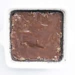 ganache layer added to dubai avocado brownies in pan
