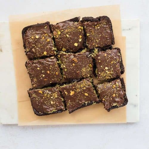 overhead image of dubai chocolate avocado brownies cut into squares