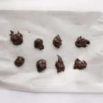 Dubai chocolate pistachio energy balls batter scooped onto a parchment lined baking pan to chill