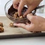 Dip the bottom of each cookie in chocolate,