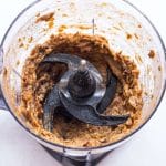 Date paste made from pitted dates, cinnamon, and vanilla in a food processor.