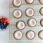 Small hole or well in the vegan cashew buttercream frosting to place strawberries and blueberries into the mound.