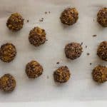 pumpkin pie spice energy balls on parchment paper to chill