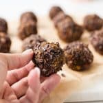 hand holding up a pumpkin spice energy bite