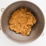 final vegan pumpkin pie cookie dough mixed together in stainless steel mixing bowl