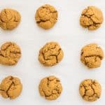 9 final baked vegan pumpkin spice cookies in rows of 3 on parchment lined baking pan