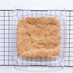 Baked sugar cookie protein bars cooling in the pan before frosting.