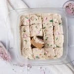 Chilled sugar cookie protein bars sliced into 12 pieces, ready to serve