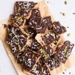 pumpkin spice banana yogurt protein bark broken up on a natural piece of parchment paper