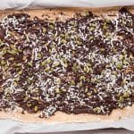 completed pumpkin banana protein bark in pan with all layers and toppings