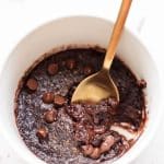 gold spoon taking scoop of pumpkin spice mug cake