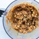 Added peanuts to Medjool dates, natural peanut butter, maple syrup, and coconut oil to make creamy caramel for high-protein, refined sugar-free Snickers bars