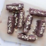 Refined sugar-free, high-protein Snickers bars sliced and ready to enjoy as a healthy snack.