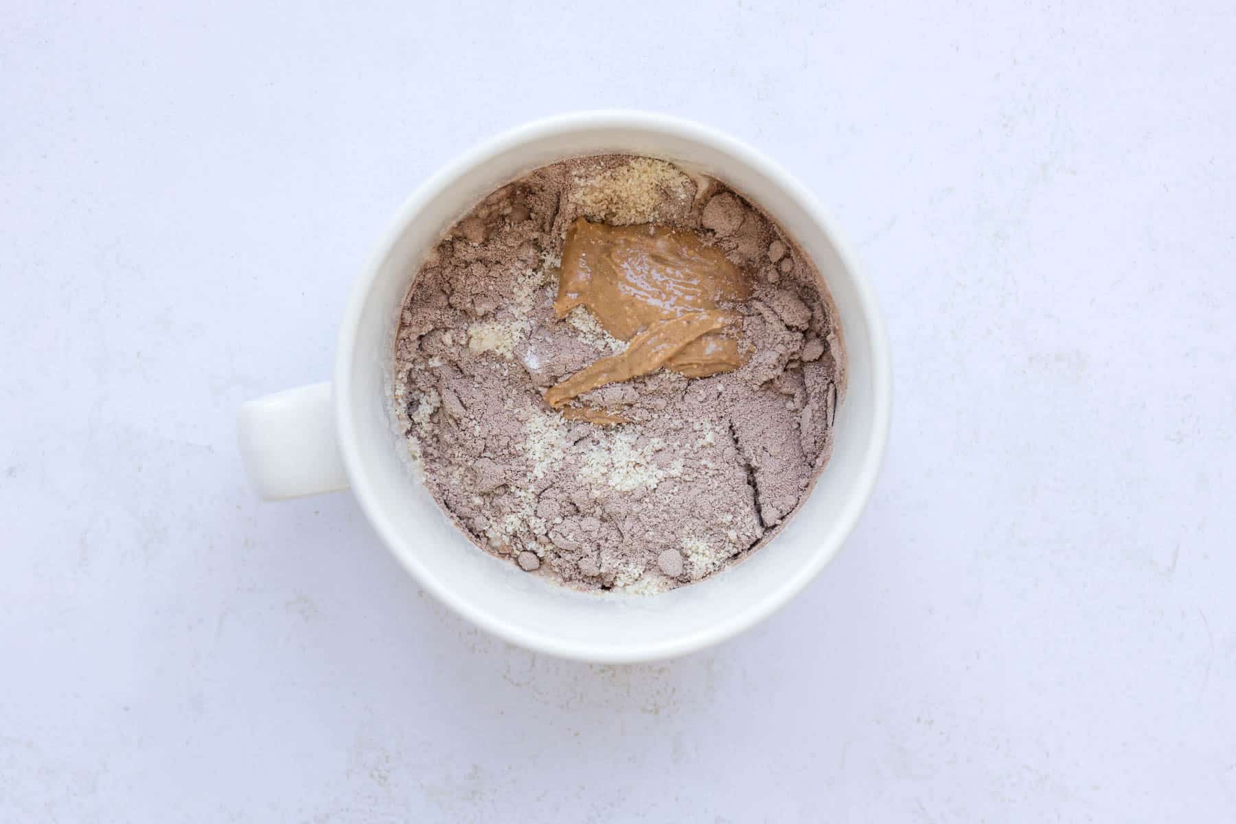 Snickers Protein Mug Cake (22g Protein) - The Sprinkled Cakery