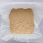baked cookie base in glass baking dish