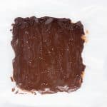 chocolate layer set on twix bars with date caramel