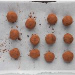 homemade truffles before chilling on baking sheet
